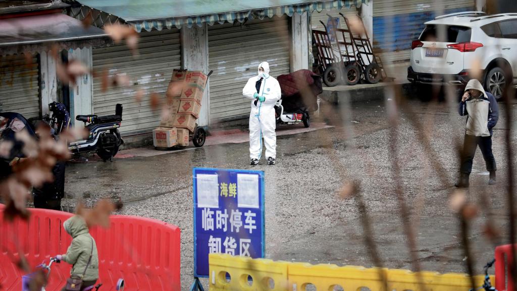 A worker in a protective suit is seen at the closed seafood market in Wuhan, Hubei province, China January 10, 2020. The seafood market is linked to the outbreak of the pneumonia caused by the new strain of coronavirus, but some patients diagnosed with the