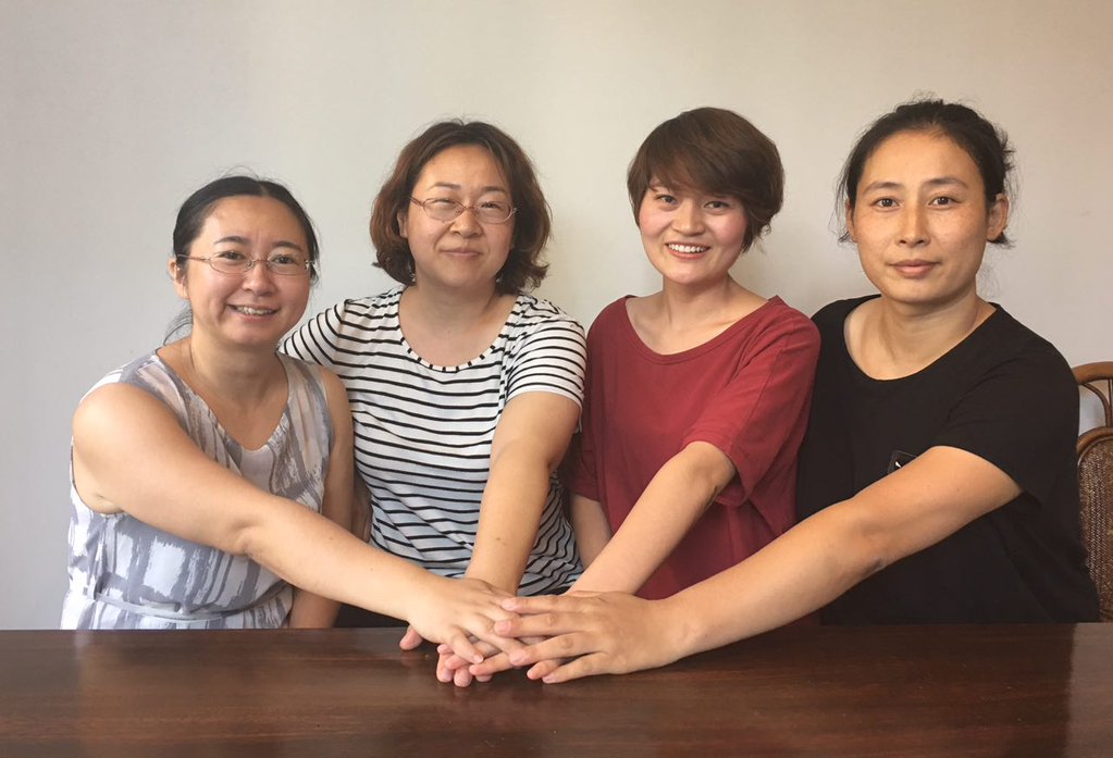 four women in solidarity
