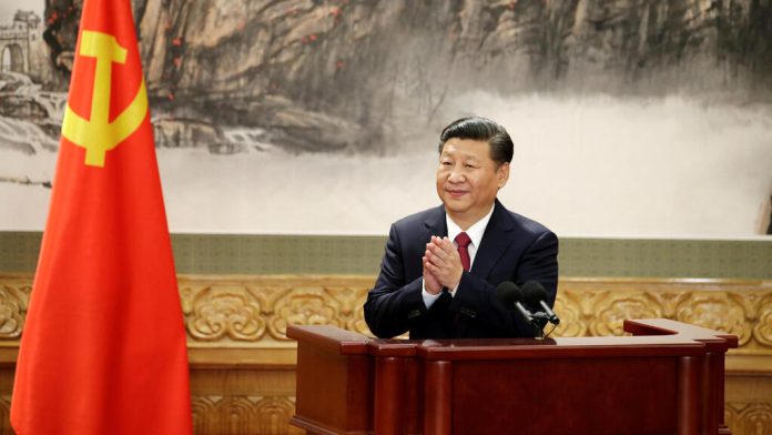 file photo: chinese president xi jinping claps after his speech as china's new politburo standing committee members meet with the press at the great hall of the people in beijing